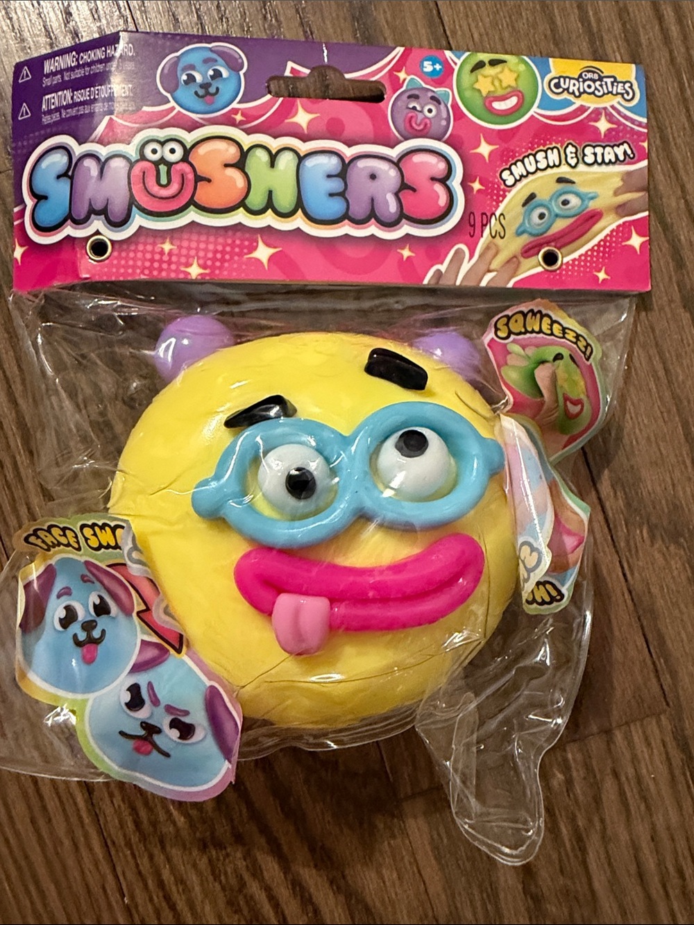 Yellow Emoji Squishy with Blue Glasses and Pink Tongue